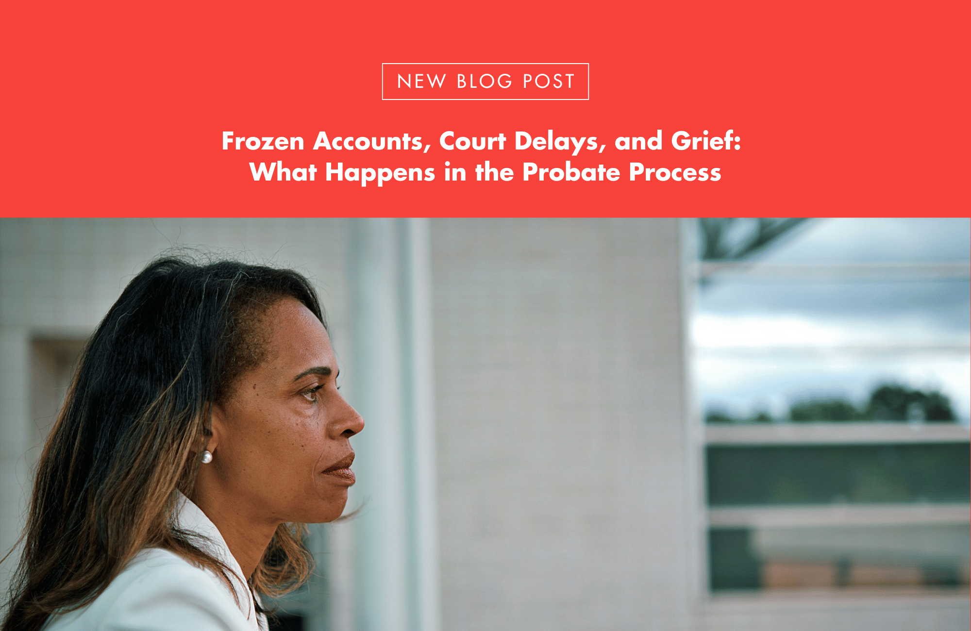 A thoughtful woman looking out a window, symbolizing the emotional impact of probate and legal delays.